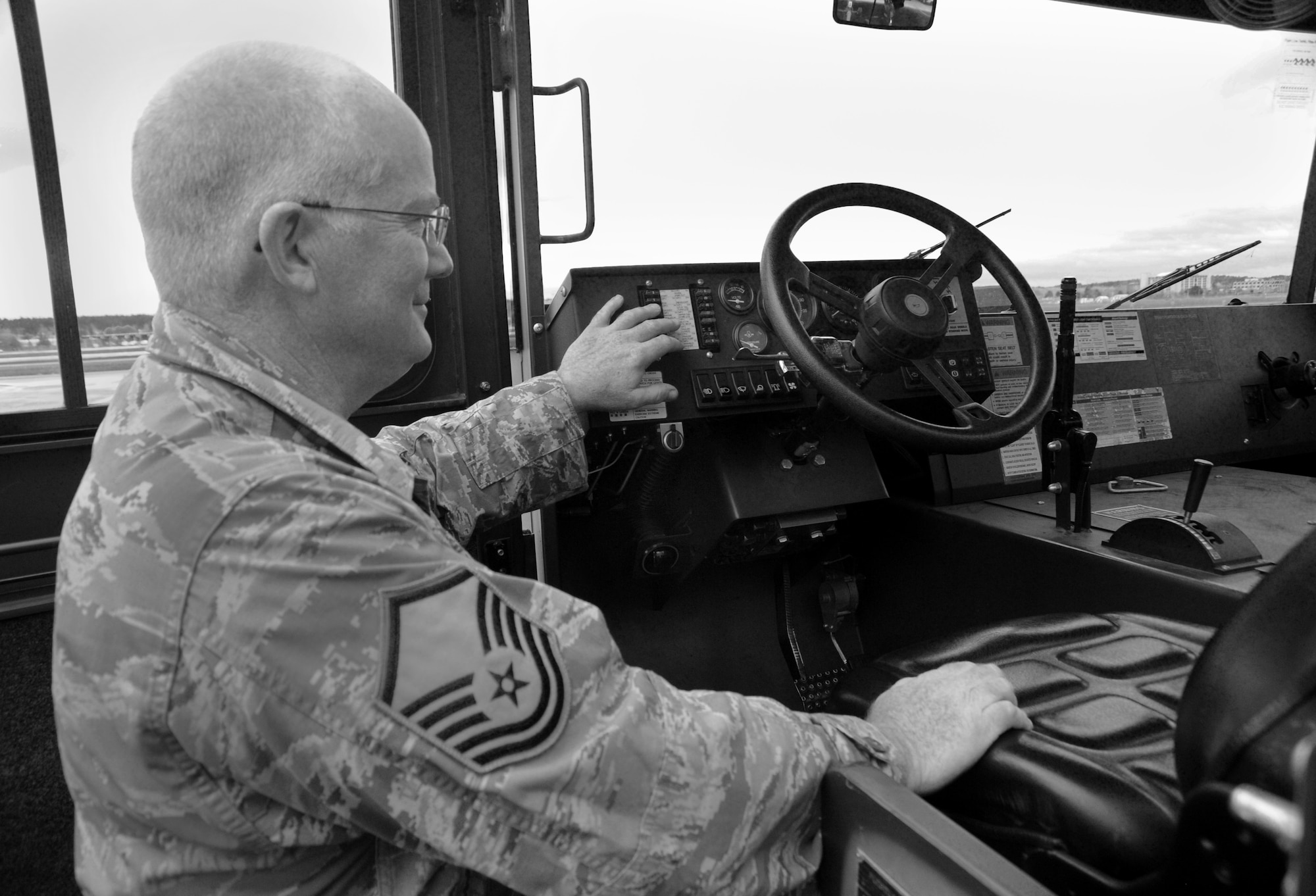 Oregon Air National Guard Master Sgt. Ronald Green, assigned to the 142nd Fighter Wing Maintenance Group, Portland Air National Guard Base, Ore., inspects a vehicle at the Alert Facility used to tow aircraft as part of daily maintenance procedures, Nov. 27, 2014. (U.S. Air National Guard photo by Tech. Sgt. John Hughel, 142nd Fighter Wing Public Affairs/Released)