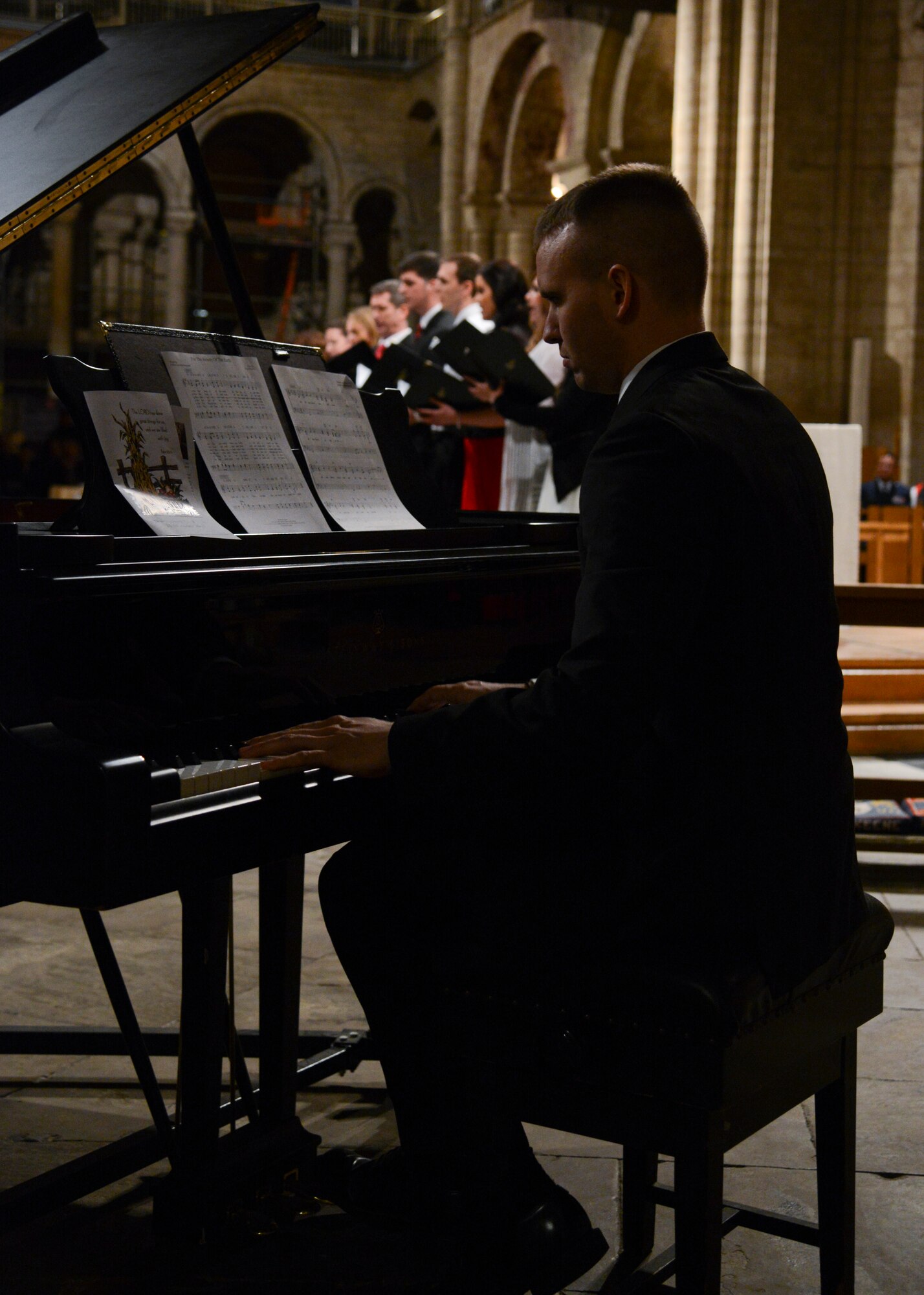 U.S. Air Force Airmen sing during the Thanksgiving Eve service Nov. 26, 2014, at Ely Cathedral, England. The annual service gave U.S. service members in England an opportunity to enjoy a holiday service at the historic cathedral. (U.S. Air Force photo by Senior Airman Victoria H. Taylor/Released)