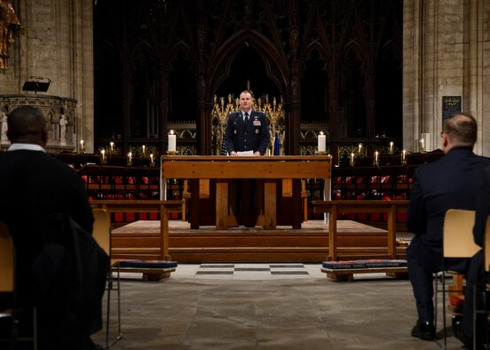 U.S. Air Force Col. Kenneth T. Bibb Jr., 100th Air Refueling Wing commander, speaks during the Thanksgiving Eve service Nov. 26, 2014, at Ely Cathedral, England. The service of thanks is conducted every year for American service members, their families and other employees of RAF Mildenhall and RAF Lakenheath. (U.S. Air Force photo by Senior Airman Victoria H. Taylor/Released)