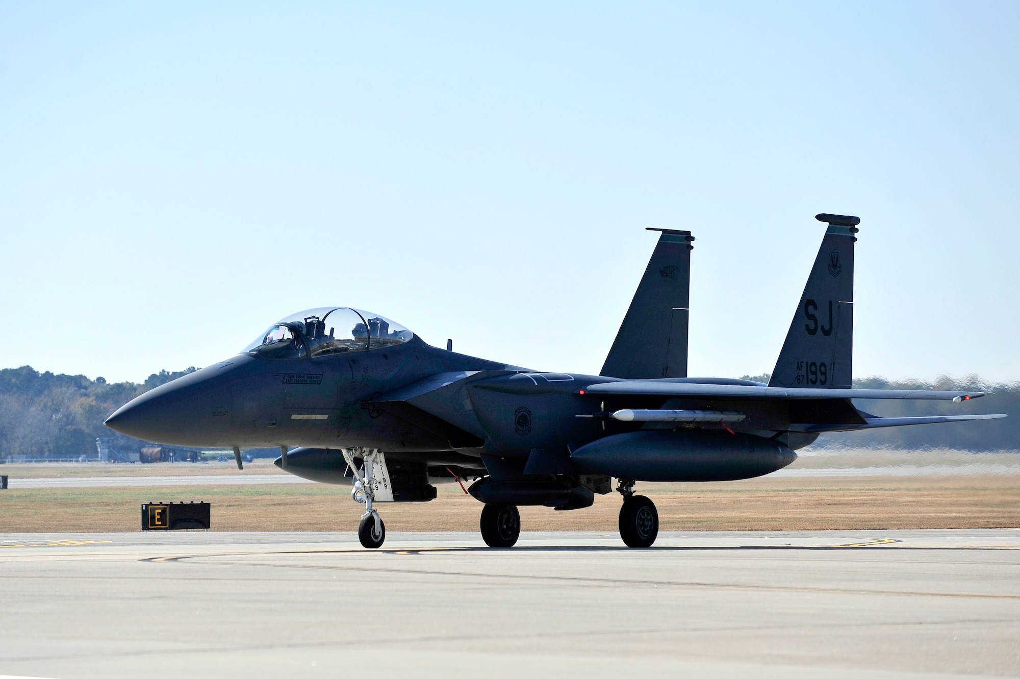 An F-15E Strike Eagle taxies onto the runway during exercise Coronet Warrior 14-03 at Seymour Johnson Air Force Base, North Carolina, Nov. 20, 2014. The 4th Fighter Wing regularly conducts exercises like Coronet Warrior to prepare Airmen for contingency operations in deployed environments. (U.S. Air Force photo/Airman Shawna L. Keyes)
