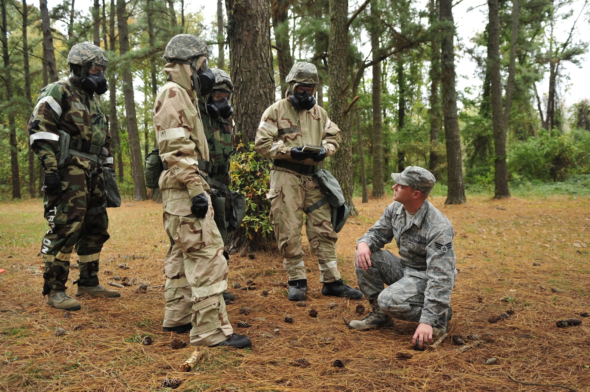 Senior Airman Timothy Roberts, 4th Civil Engineer Squadron emergency management technician, explains the proper unexploded ordnance procedure during exercise Coronet Warrior 14-03 at Seymour Johnson Air Force Base, North Carolina, Nov. 17, 2014. Airmen participating in the Ability To Survive and Operate rodeo demonstrated their knowledge of the five “Cs,” confirm, clear, cordon, check and control. (U.S. Air Force photo/Airman Shawna L. Keyes)
