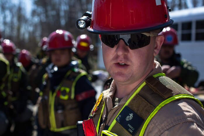Marines and Sailors of the Chemical Biological Incident Response Force, II Marine Expeditionary Force, conduct a live chemical agent exercise at Fort A.P. Hill, Virginia on April 10. The unit conducted simulated casualty extraction in clouds of CS gas to prepare for real life evacuation situations. In order to execute its mission, CBIRF possesses a wide variety of unique skill sets that are task organized to address all possible aspects of a CBRNE attack. CBIRF has six major sections organic to the battalion: Explosive Ordnance Disposal, Technical Search and Rescue, Decontamination, Medical, Identification and Detection, and Search and Rescue/Casualty Extraction. (Official Marine Corps Photo by Sgt Kuande L. Hall/Released)


