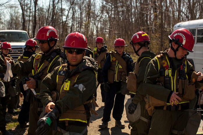 Marines and Sailors of the Chemical Biological Incident Response Force, II Marine Expeditionary Force, conduct a live chemical agent exercise at Fort A.P. Hill, Virginia on April 10. The unit conducted simulated casualty extraction in clouds of CS gas to prepare for real life evacuation situations. In order to execute its mission, CBIRF possesses a wide variety of unique skill sets that are task organized to address all possible aspects of a CBRNE attack. CBIRF has six major sections organic to the battalion: Explosive Ordnance Disposal, Technical Search and Rescue, Decontamination, Medical, Identification and Detection, and Search and Rescue/Casualty Extraction. (Official Marine Corps Photo by Sgt Kuande L. Hall/Released)


