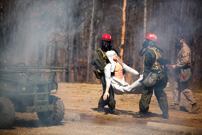 Marines and Sailors of the Chemical Biological Incident Response Force, II Marine Expeditionary Force, conduct a live chemical agent exercise at Fort A.P. Hill, Virginia on April 10. The unit conducted simulated casualty extraction in clouds of CS gas to prepare for real life evacuation situations. In order to execute its mission, CBIRF possesses a wide variety of unique skill sets that are task organized to address all possible aspects of a CBRNE attack. CBIRF has six major sections organic to the battalion: Explosive Ordnance Disposal, Technical Search and Rescue, Decontamination, Medical, Identification and Detection, and Search and Rescue/Casualty Extraction. (Official Marine Corps Photo by Sgt Kuande L. Hall/Released)


