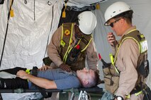Marines and Sailors with the Chemical Biological Incident Response Force conduct training along with local first responders during Exercise Capital Shield. Capital Shield is a regional training exercise coordinated by Joint Force Headquarters - National Capital Region in coordination with the DoD. (Official Marine Corps Photo by Sgt Kuande L Hall/RELEASED)


