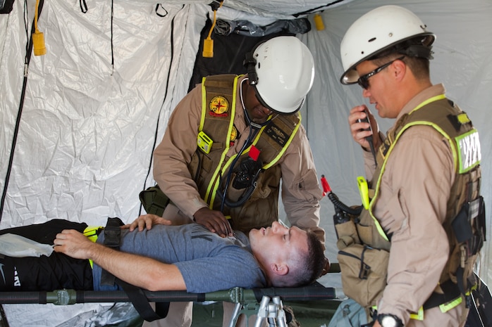 Marines and Sailors with the Chemical Biological Incident Response Force conduct training along with local first responders during Exercise Capital Shield. Capital Shield is a regional training exercise coordinated by Joint Force Headquarters - National Capital Region in coordination with the DoD. (Official Marine Corps Photo by Sgt Kuande L Hall/RELEASED)


