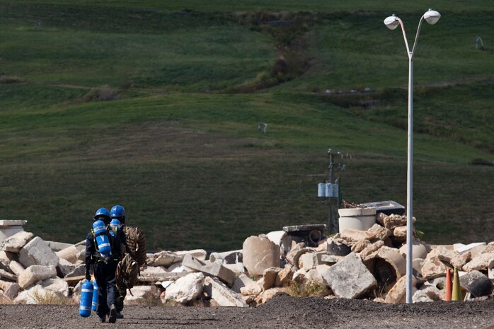Marines and Sailors with the Chemical Biological Incident Response Force conduct training along with local first responders during Exercise Capital Shield. Capital Shield is a regional training exercise coordinated by Joint Force Headquarters - National Capital Region in coordination with the DoD. (Official Marine Corps Photo by Sgt Kuande L Hall/RELEASED)


