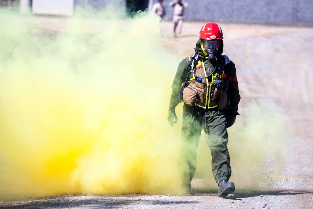 Marines and Sailors of the Chemical Biological Incident Response Force, II Marine Expeditionary Force conduct a live chemical agent exercise at Fort A.P. Hill, Virginia on April 10. The unit conducted simulated casualty extraction in clouds of CS gas to prepare for real life evacuation situations. In order to execute its mission, CBIRF possesses a wide variety of unique skill sets that are task organized to address all possible aspects of a CBRNE attack. CBIRF has six major sections organic to the battalion: Explosive Ordnance Disposal, Technical Search and Rescue, Decontamination, Medical, Identification and Detection, and Search and Rescue/Casualty Extraction. (Official Marine Corps Photo by Sgt Kuande L. Hall/Released)


