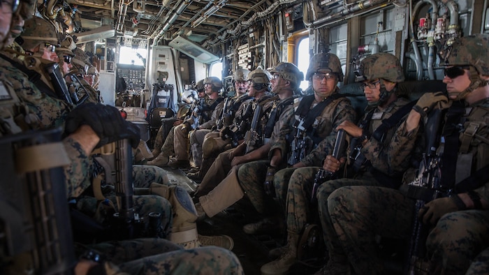 U.S. Marines with the Maritime Raid Force and Security Element of the 15th Marine Expeditionary Unit, ride in a CH-53 Super Stallion during interoperability training aboard Camp Pendleton, Calif., Nov. 20, 2014. Interop gives the 15th MEU’s MRF and Security Element an opportunity to work together and support each other in preparation for a deployment in the spring. 