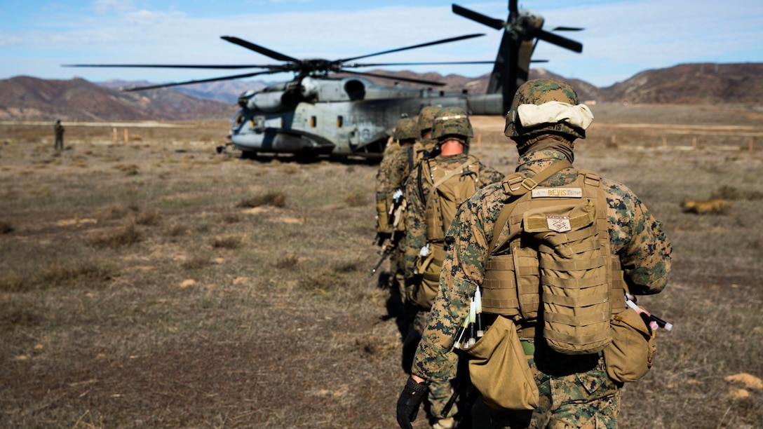 U.S. Marines with the Maritime Raid Force’s Security Element, 15th Marine Expeditionary Unit, load onto a CH-53 Super Stallion during interoperability training aboard Camp Pendleton, Calif., Nov. 19, 2014. Interop gives the 15th MEU’s MRF and Security Element an opportunity to work together and support each other in preparation for a deployment in the spring. 