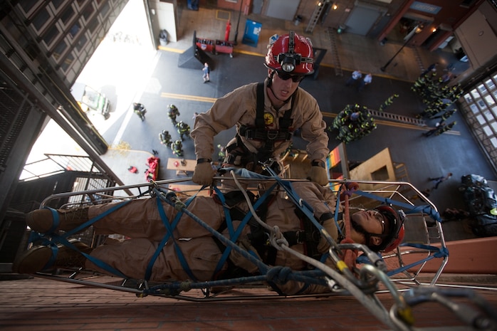 Marines and sailors with the Chemical Biological Incident Response Force conducted an annual training exercise alongside the New York City Fire Department at a training academy in Randall's Island, New York. CBIRF conducted rope rescue, vehicle extrication, structural collapse and confined space training during the week long exercise. The event culminated with a night operation at the Barclay's Center in Brooklyn, where Marines and sailors rescued role-playing casualties from a simulated bomb explosion. The mission of CBIRF is to forward-deploy and/or respond, when directed, to a credible threat of chemical, biological, radiological, nuclear or high-yield explosive incident in order to assist local, state or federal agencies and unified combat commanders in the conduct of consequence management operations. (Official Marine Corps Photo by Sgt Kuande Hall/RELEASED)


