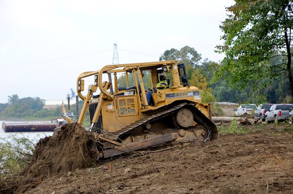 Memphis District’s Clearing and Snagging Unit works on the river bank near West Memphis, Arkansas, Oct. 10. As the first step of Revetment Operations, crew members clear the river banks of trees and debris to make way for the Bank Grading Unit and the Matt Sinking Unit. The work’s accomplished using a barge mounted dragline, bulldozers, and backhoes. Revetment Operations normally run from July to November each year. (USACE Photo/Brenda Beasley)