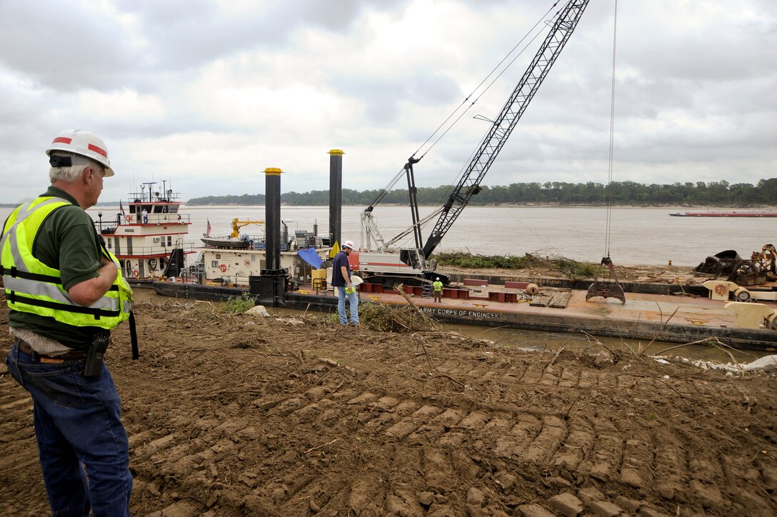 In the foreground, the River & Harbors Construction & Maintenance Foreman oversees operations. (USACE Photo/Brenda Beasley)