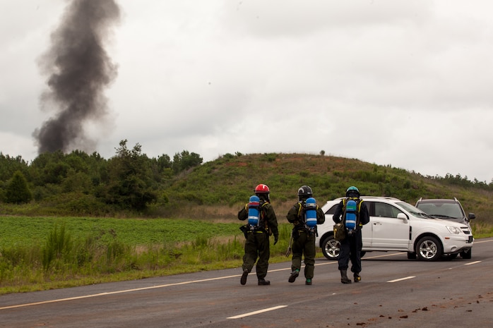 Marines and Sailors of the Chemical Biological Incident Response Force, II Marine Expeditionary Force participate in Exercise Scarlet Response at Guardian Centers in Perry, Ga., July 21. CBIRF personnel are trained to exercise command and control, agent detection and identification, search, rescue and decontamination, and emergency care for contaminated personnel. During Scarlet Response, the Marines and Sailors are testing their ability to detect radiation, locate casualties, conduct vehicle extrication, and perform decontamination of simulated casualties that have resulted from a mock nuclear explosion in a major U.S. city. Exercise Scarlet Response is being executed as part of Exercise Vibrant Response 14, a combined Command Post Exercise/Field Training Exercise directed by Commander, U.S. Northern Command. (Official Marine Corps Photo by Sgt Kuande L Hall/Released)


