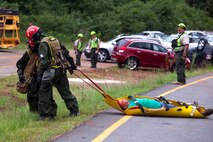 Marines and Sailors of the Chemical Biological Incident Response Force, II Marine Expeditionary Force participate in Exercise Scarlet Response at Guardian Centers in Perry, Ga., July 21. CBIRF personnel are trained to exercise command and control, agent detection and identification, search, rescue and decontamination, and emergency care for contaminated personnel. During Scarlet Response, the Marines and Sailors are testing their ability to detect radiation, locate casualties, conduct vehicle extrication, and perform decontamination of simulated casualties that have resulted from a mock nuclear explosion in a major U.S. city. Exercise Scarlet Response is being executed as part of Exercise Vibrant Response 14, a combined Command Post Exercise/Field Training Exercise directed by Commander, U.S. Northern Command. (Official Marine Corps Photo by Sgt Kuande L Hall/Released)


