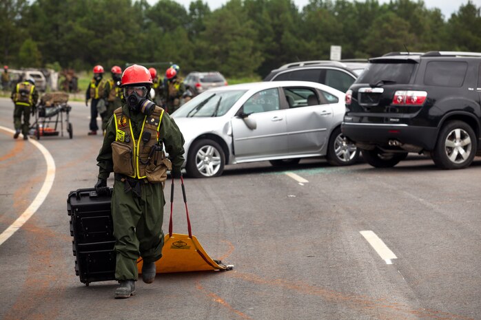 Marines and Sailors of the Chemical Biological Incident Response Force, II Marine Expeditionary Force participate in Exercise Scarlet Response at Guardian Centers in Perry, Ga., July 21. CBIRF personnel are trained to exercise command and control, agent detection and identification, search, rescue and decontamination, and emergency care for contaminated personnel. During Scarlet Response, the Marines and Sailors are testing their ability to detect radiation, locate casualties, conduct vehicle extrication, and perform decontamination of simulated casualties that have resulted from a mock nuclear explosion in a major U.S. city. Exercise Scarlet Response is being executed as part of Exercise Vibrant Response 14, a combined Command Post Exercise/Field Training Exercise directed by Commander, U.S. Northern Command. (Official Marine Corps Photo by Sgt Kuande L Hall/Released)


