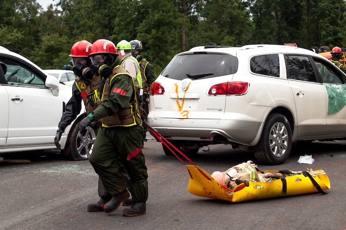 Marines and Sailors of the Chemical Biological Incident Response Force, II Marine Expeditionary Force participate in Exercise Scarlet Response at Guardian Centers in Perry, Ga., July 21. CBIRF personnel are trained to exercise command and control, agent detection and identification, search, rescue and decontamination, and emergency care for contaminated personnel. During Scarlet Response, the Marines and Sailors are testing their ability to detect radiation, locate casualties, conduct vehicle extrication, and perform decontamination of simulated casualties that have resulted from a mock nuclear explosion in a major U.S. city. Exercise Scarlet Response is being executed as part of Exercise Vibrant Response 14, a combined Command Post Exercise/Field Training Exercise directed by Commander, U.S. Northern Command. (Official Marine Corps Photo by Sgt Kuande L Hall/Released)



