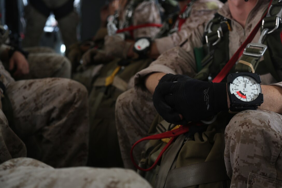 United States Marine Critical Skills Operators with 1st Marine Special Operations Battalion, Marine Corps Forces, Special Operations Command, wait aboard a CASA 212 aircraft in the process of gaining altitude to conduct a double-bag static line (DBSL) jump, during a DBSL parachute training course, Aug 26, 2014, in rural Arizona.  The DBSL course is an introduction to the High Altitude, High Opening (HAHO) insertion method utilized by Special Operations Forces. (U.S. Marine Corps Photo by Lance Cpl. Steven M. Fox/Released)