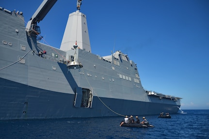 140916-N-FO359-458
PACIFIC OCEAN (Sept. 16, 2014) Sailors from the amphibious transport dock ship USS Anchorage (LPD 23) and Navy divers assigned to Explosive Ordnance Disposal Mobile Unit (EODMU) 11, Mobile Dive and Salvage Company 11-7, participate in the fourth underway recovery test (URT-4) for the NASA Orion Program. URT-4 is the fourth at-sea testing for the Orion crew module using a well deck recovery method. 