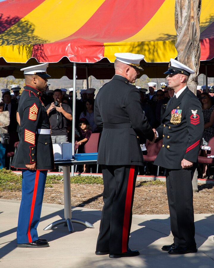 Major Gen. Joseph L. Osterman, commander, U.S. Marine Corps Forces Special Operations Command, awards the Navy Cross to Chief Petty Officer Justin A. Wilson, a Special Amphibious Reconnaissance Corpsman, with 1st MSOB aboard Camp Pendleton, Calif., on Nov. 25, 2014. The Navy Cross is the second highest valor award, second to the Medal of Honor, and must be approved by the Secretary of the Navy before being awarded (U.S. Marine Corps Photo by Sgt. Scott A. Achtemeier / Released)