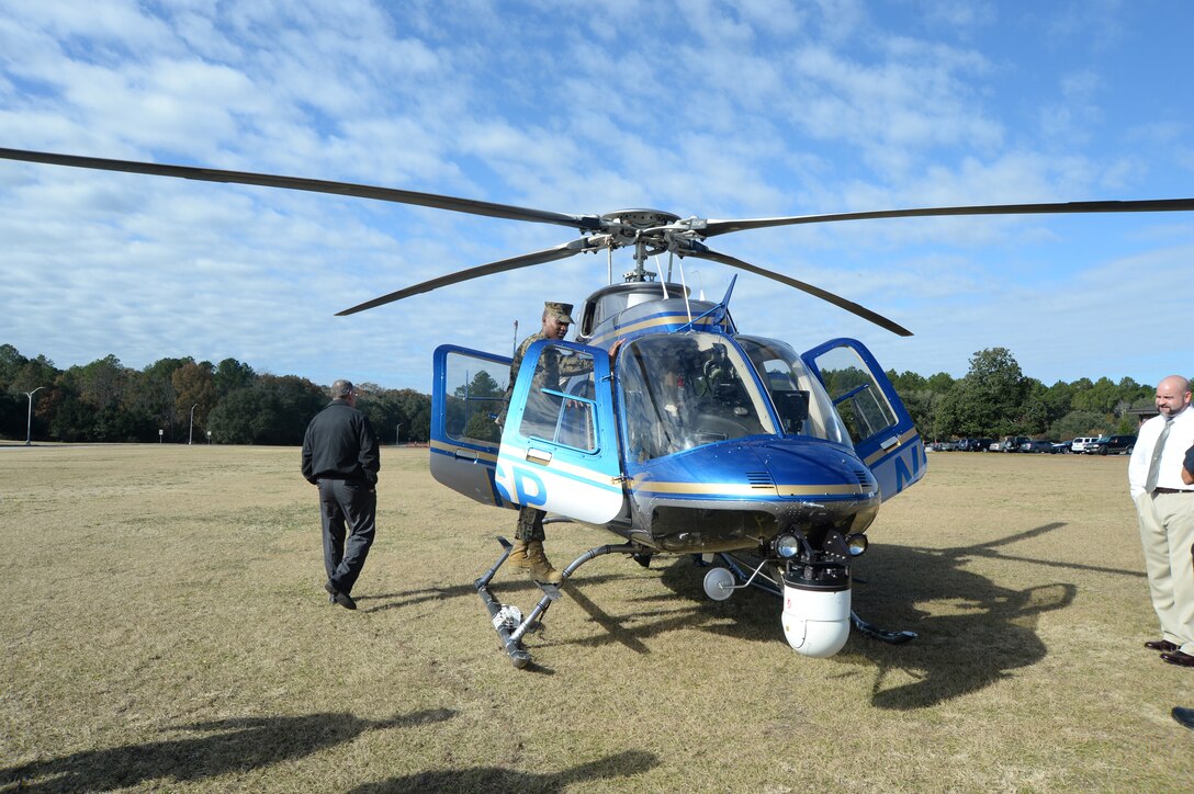 The Georgia State Patrol, Aviation Division, conducts training with Marine Corps Logistics Base Albany through helicopter landings and low altitude flights over the installation. A single aircraft demonstrated landings and take offs on MCLB Albany's Schmid Field, in front of Building 3500, and at Boyett Park, Dec. 2.