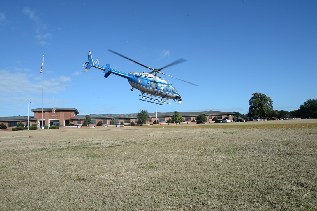 The Georgia State Patrol, Aviation Division, conducts training with Marine Corps Logistics Base Albany through helicopter landings and low altitude flights over the installation. A single aircraft demonstrated landings and take offs on MCLB Albany's Schmid Field, in front of Building 3500, and at Boyett Park, Dec. 2.