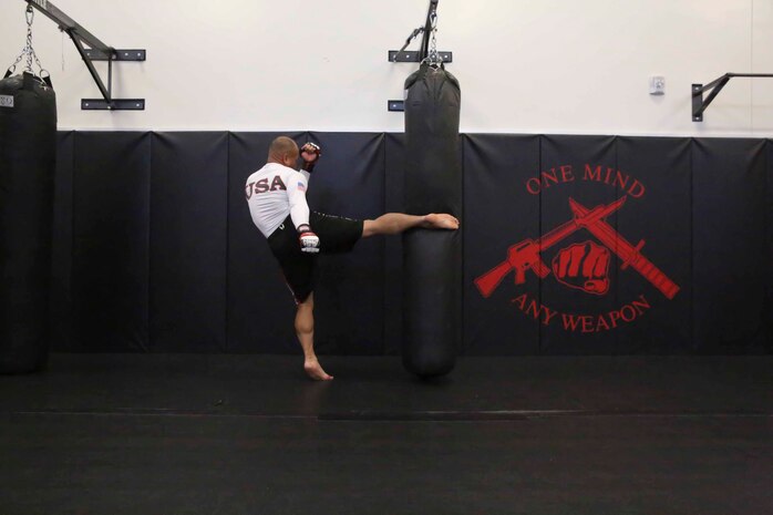 Major Jackson Doan, operation officer, Edson Range, Weapons Field Training Battalion, Marine Corps Base Camp Pendleton, practices his leg kicks at Marine Corps Base Camp Pendleton, Nov. 19. Doan is an Oceanside, Calif., native and is the current Pankration World Champion in the 145 pound weight class.