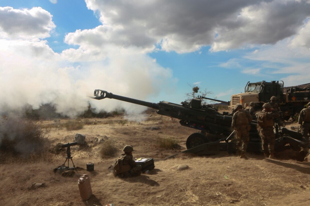 U.S. Marines with India Battery, Battalion Landing Team 3rd Battalion, 1st Marine Regiment, 15th Marine Expeditionary Unit, carry out a fire mission during MEU Exercise 14 aboard Camp Pendleton, Calif., Nov. 20, 2014. The purpose of MEUEX is to train the different elements of the 15th MEU to work together to complete a wide variety of missions. (U.S. Marine Corps photo by Sgt. Jamean R. Berry/Released)
