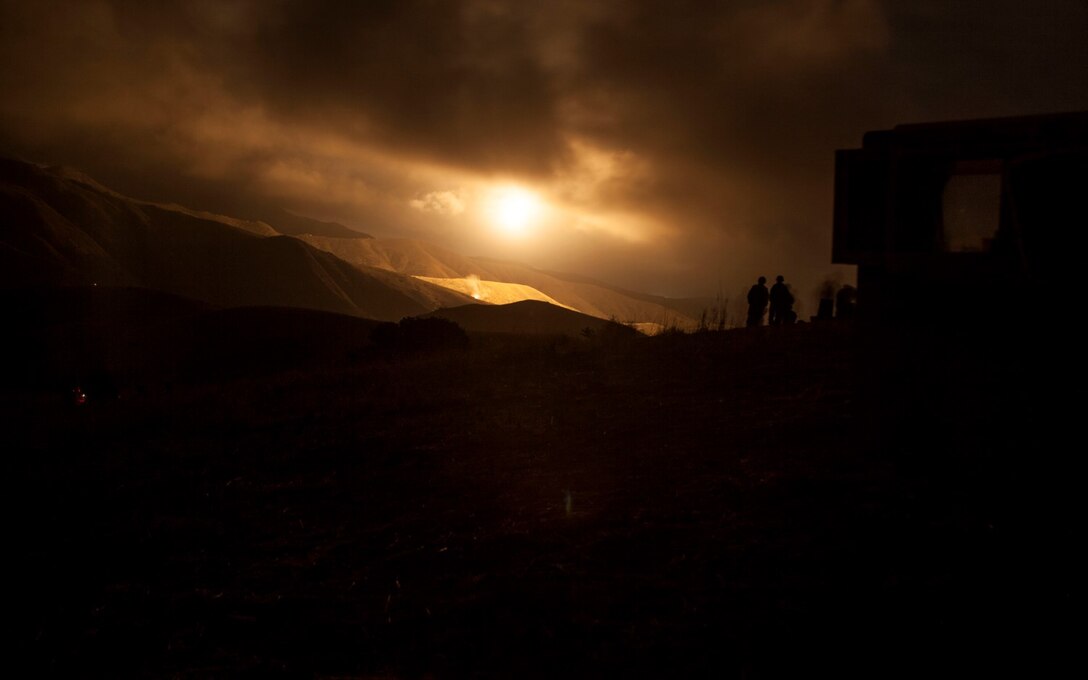 U.S. Marines with India Battery, Battalion Landing Team 3rd Battalion, 1st Marine Regiment, 15th Marine Expeditionary Unit, fire an illumination round from the M777A2 Lightweight Howitzer during MEU Exercise 14 aboard Camp Pendleton, Calif., Nov. 20, 2014. The purpose of MEUEX is to train the different elements of the 15th MEU to work together to complete a wide variety of missions. (U.S. Marine Corps photo by Cpl. Elize McKelvey/Released)