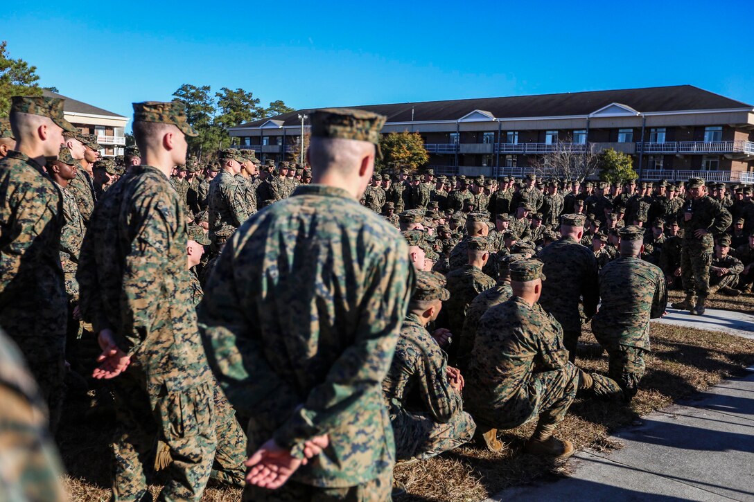 U.S. Marine Corps Col. William R. Dunn, right, 22nd Marine Expeditionary Unit (MEU) commanding officer, speaks to Battalion Landing Team (BLT) 1st Battalion, 6th Marine Regiment, before decompositing the MEU Dec. 1, 2014, at Marine Corps Base Camp Lejeune, N.C. The MEU completed a nine-month deployment to the U.S. 5th and 6th Fleet areas of operation with the Bataan Amphibious Ready Group. (U.S. Marine Corps photo by Sgt. Austin Hazard/Released)