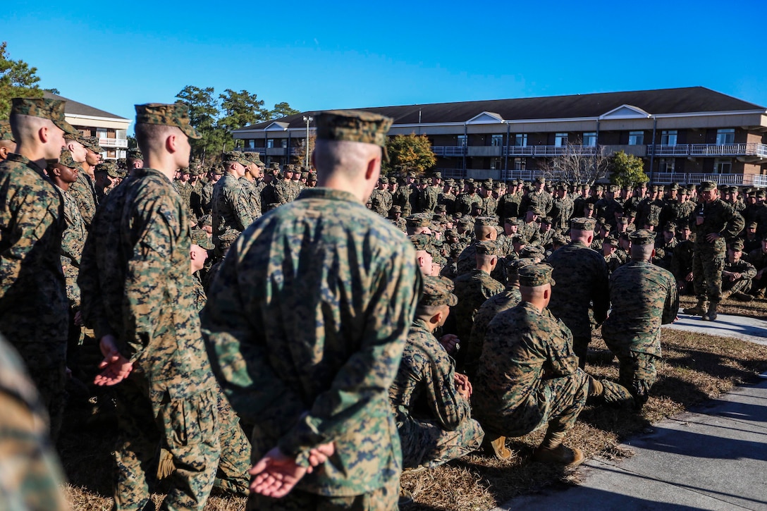 U.S. Marine Corps Col. William R. Dunn, right, 22nd Marine Expeditionary Unit (MEU) commanding officer, speaks to Battalion Landing Team (BLT) 1st Battalion, 6th Marine Regiment, before decompositing the MEU Dec. 1, 2014, at Marine Corps Base Camp Lejeune, N.C. The MEU completed a nine-month deployment to the U.S. 5th and 6th Fleet areas of operation with the Bataan Amphibious Ready Group. (U.S. Marine Corps photo by Sgt. Austin Hazard/Released)