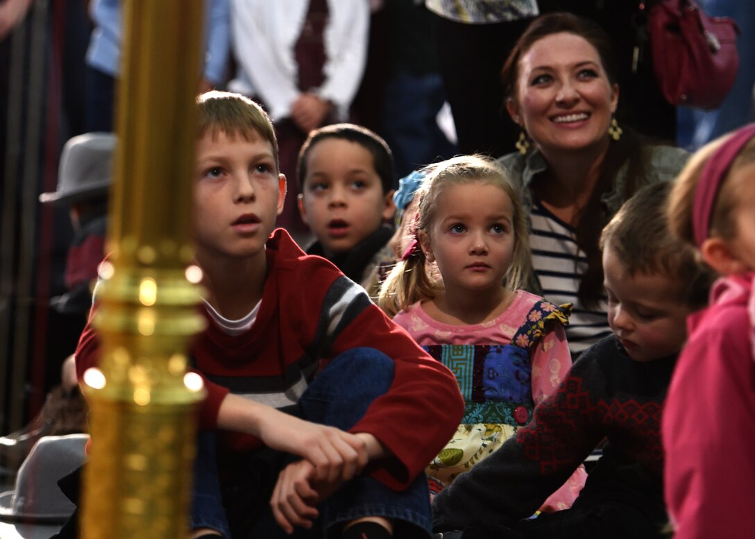 Audience members watch the United States Air Force Band Singing Sergeants during a flash mob at the Smithsonian National Air and Space Museum Udvar-Hazy Center in Chantilly, Va., Dec. 2, 2014. The Udvar-Hazy Center is home to thousands of aviation and space artifacts and is the companion facility to the Museum on the National Mall in Washington, DC. (U.S. Air Force photo/ Senior Airman Nesha Humes)