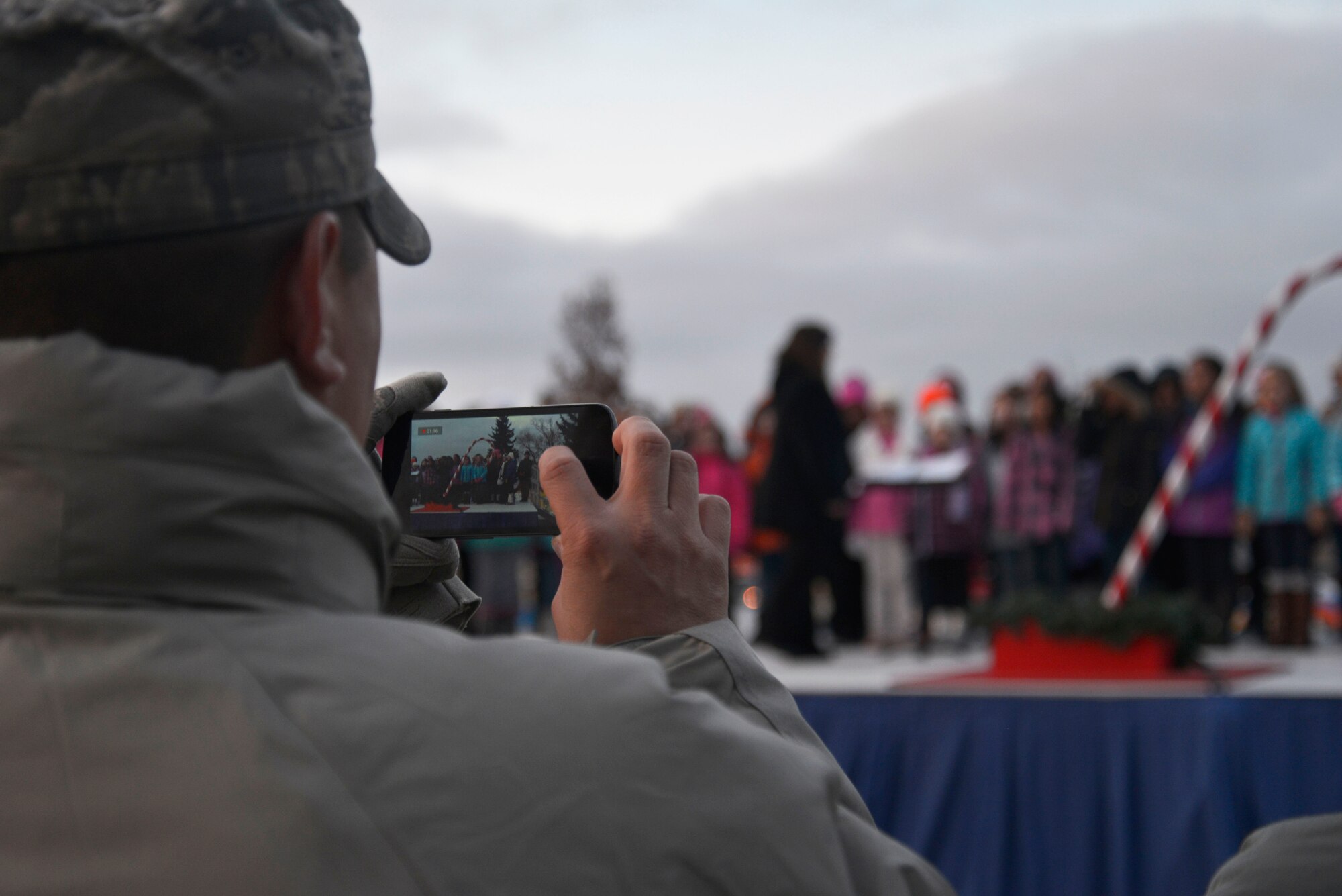 Members of Team Fairchild gather in front of the base chapel to witness the annual tree lighting ceremony Dec. 1, 2014, at Fairchild Air Force Base, Wash. The ceremony marks the start of the holiday season. (U.S. Air Force photo/Airman 1st Class Janelle Patiño)