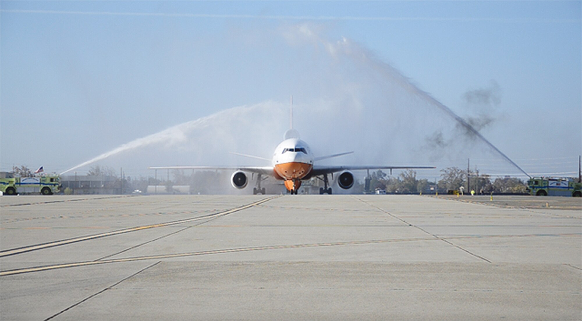 10 Tanker Air Carrier’s DC-10, dubbed “910,” gets a final salute from firefighters in Castle Airport, Calif., upon completion of its last mission. It was one of three DC-10s based across the airfield from Kirtland. (Courtesy photo)