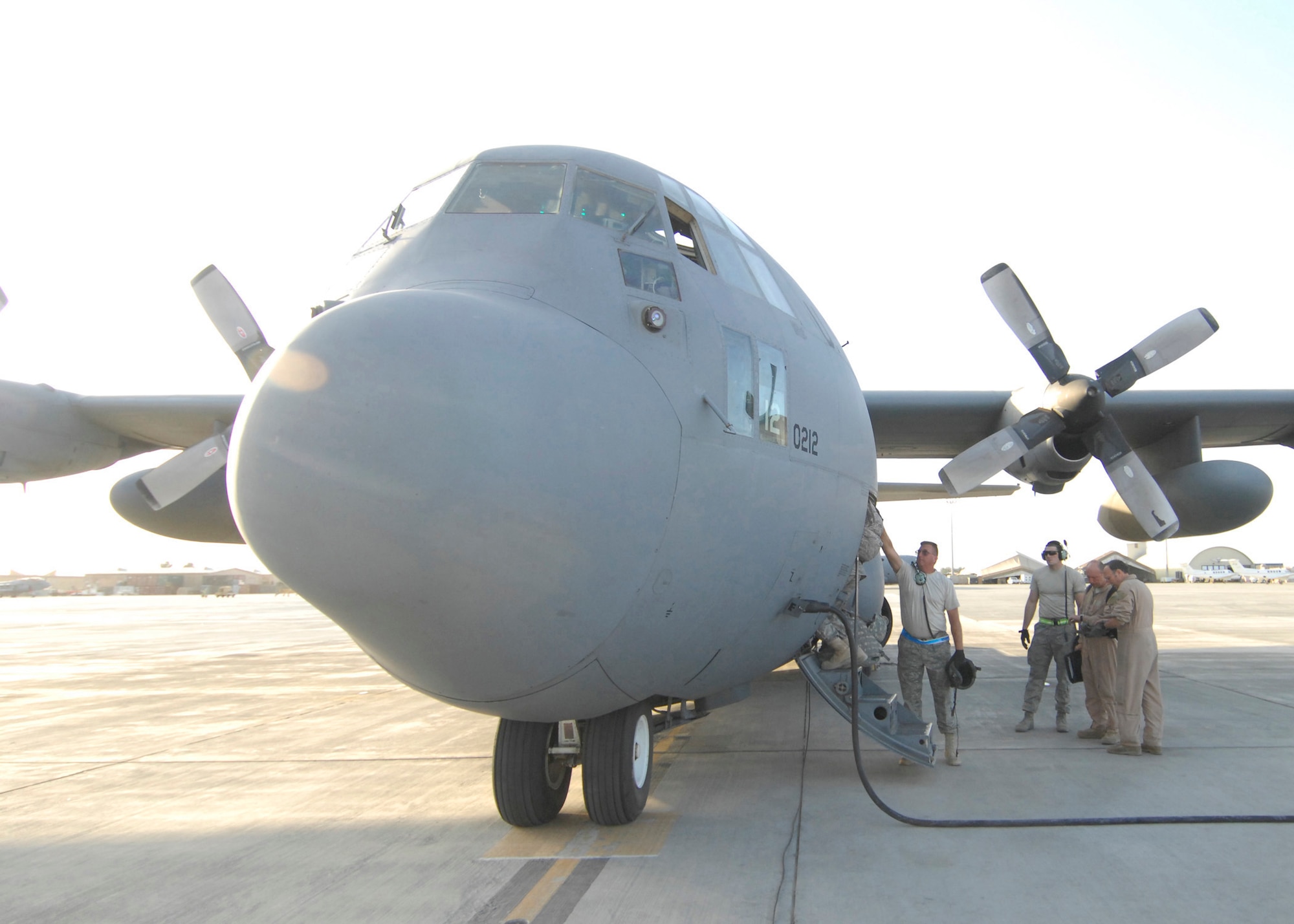 A loadmaster on a Delaware Air National Guard C-130 gives a hand to an Airman leaving Bagram Airfield, Afghanistan, Oct. 18, 2009. (U.S. Air Force photo by Senior Airman Susan Tracy)