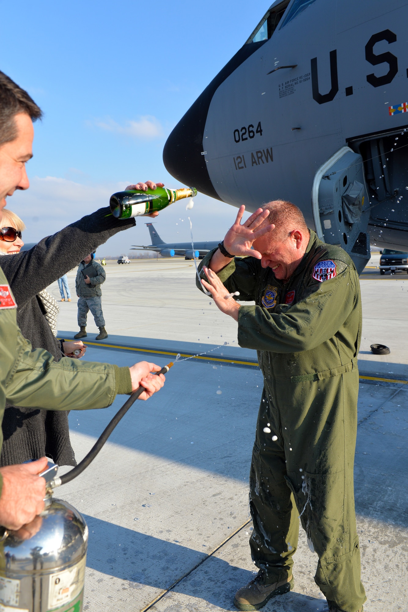 Chief Master Sgt. Tom Guard, a boom operator in the 121st Air Refueling Wing, receives a shower after his final flight  Nov. 26, 2014, at Rickenbacker Air National Guard Base, Ohio. Guard served 41 years in the military and is set to retire on Dec. 19, 2014.  (U.S. Air National Guard photo by Master Sgt. Ralph Branson/Released)
