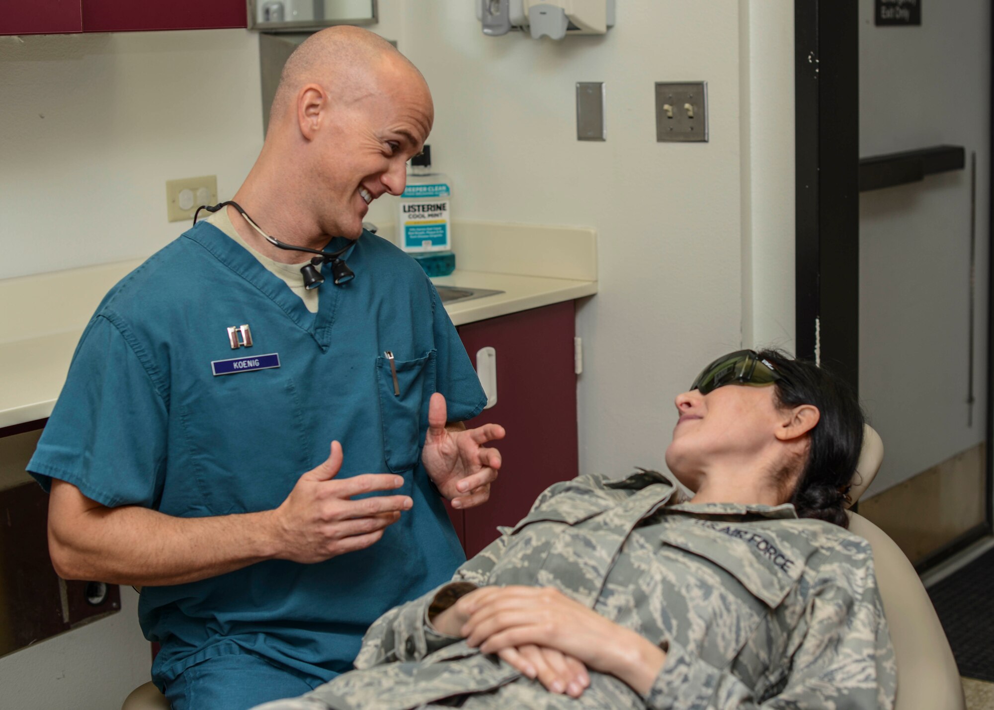 Capt. Eric Koenig, 412th Aerospace Medicine Squadron dentist, consults with a patient at the Edwards AFB Dental Office. (U.S. Air Force photo by Rebecca Amber)