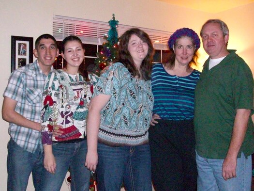 Christmas together in the Crossen household, Douglas, myself, my younger sister Darby, and my Mom and Dad, who had come to visit us while we were living at Scott Air Force Base, Ill., Dec. 24, 2010. The holidays consisted of movie marathons that included ‘Frosty the Snowman’ and catching up on the latest goings-on in our lives while basking in the glow of our twiggy Christmas tree. (Photo courtesy of Airman 1st Class Erica Crossen)