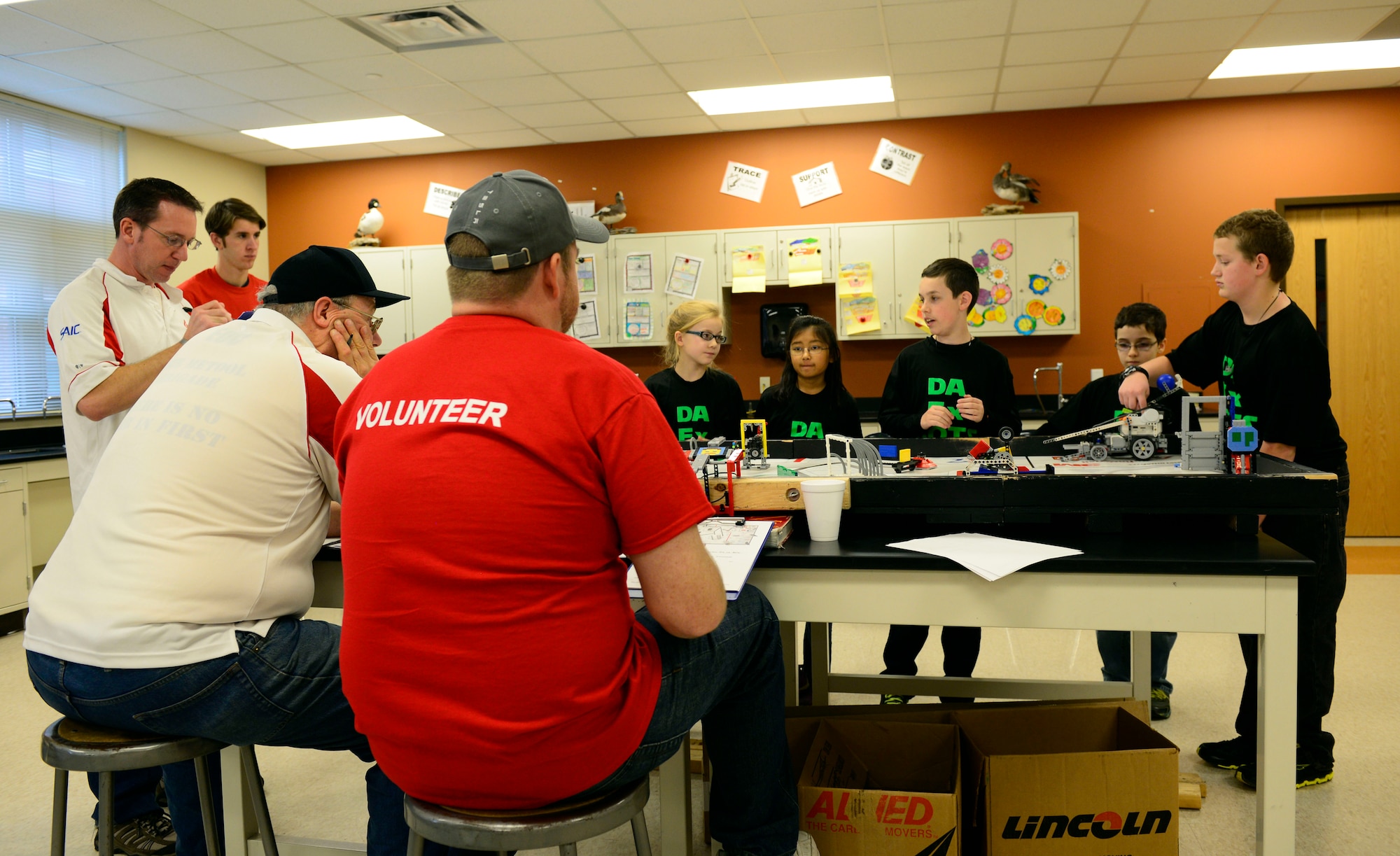 A team briefs judges on their robot design during a FIRST (For Inspiration and Recognition of Science and Technology) robotics qualifying tournament Nov. 22. Junior high school students from the O’Fallon and Edwardsville school districts (plus home-schooled teams) competed in the first Southwest Illinois qualifier of the year. Each team receives points and the top three teams with the most points advance to regionals.  (U.S. Air Force photo/ Staff Sgt. Stephenie Wade)