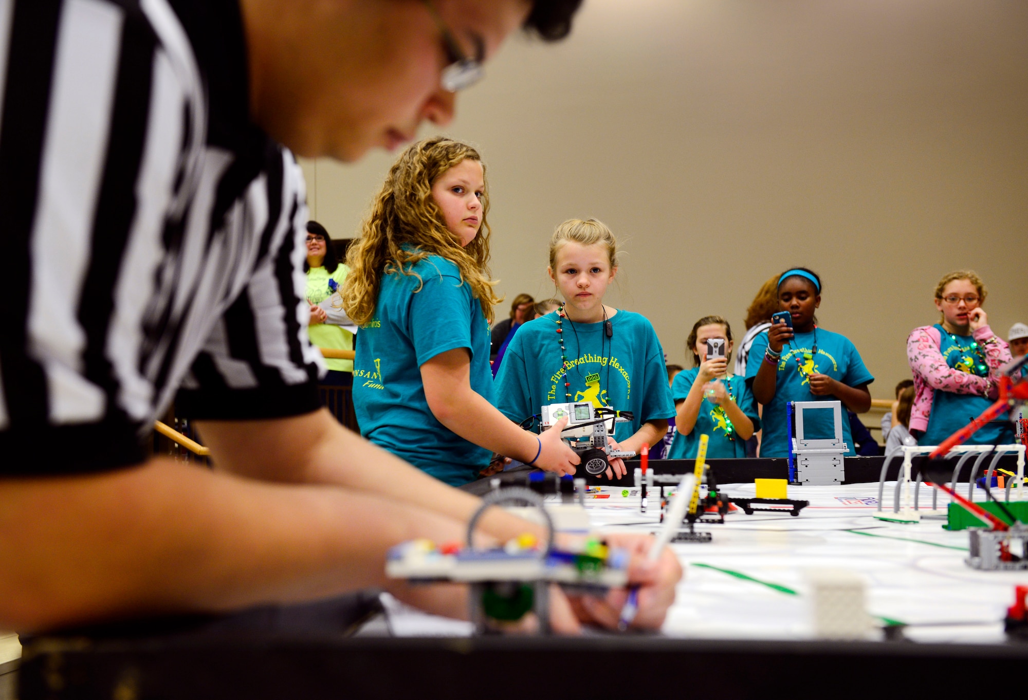 A judge totals up points for team during a robotics competition Nov. 22, 2014. Junior high school students from the O’Fallon and Edwardsville school districts (plus home-schooled teams) competed at Carriel Junior High School in O’Fallon in the FIRST (For Inspiration and Recognition of Science and Technology) robotics qualifying tournament. (U.S. Air Force photo/ Staff Sgt. Stephenie Wade)