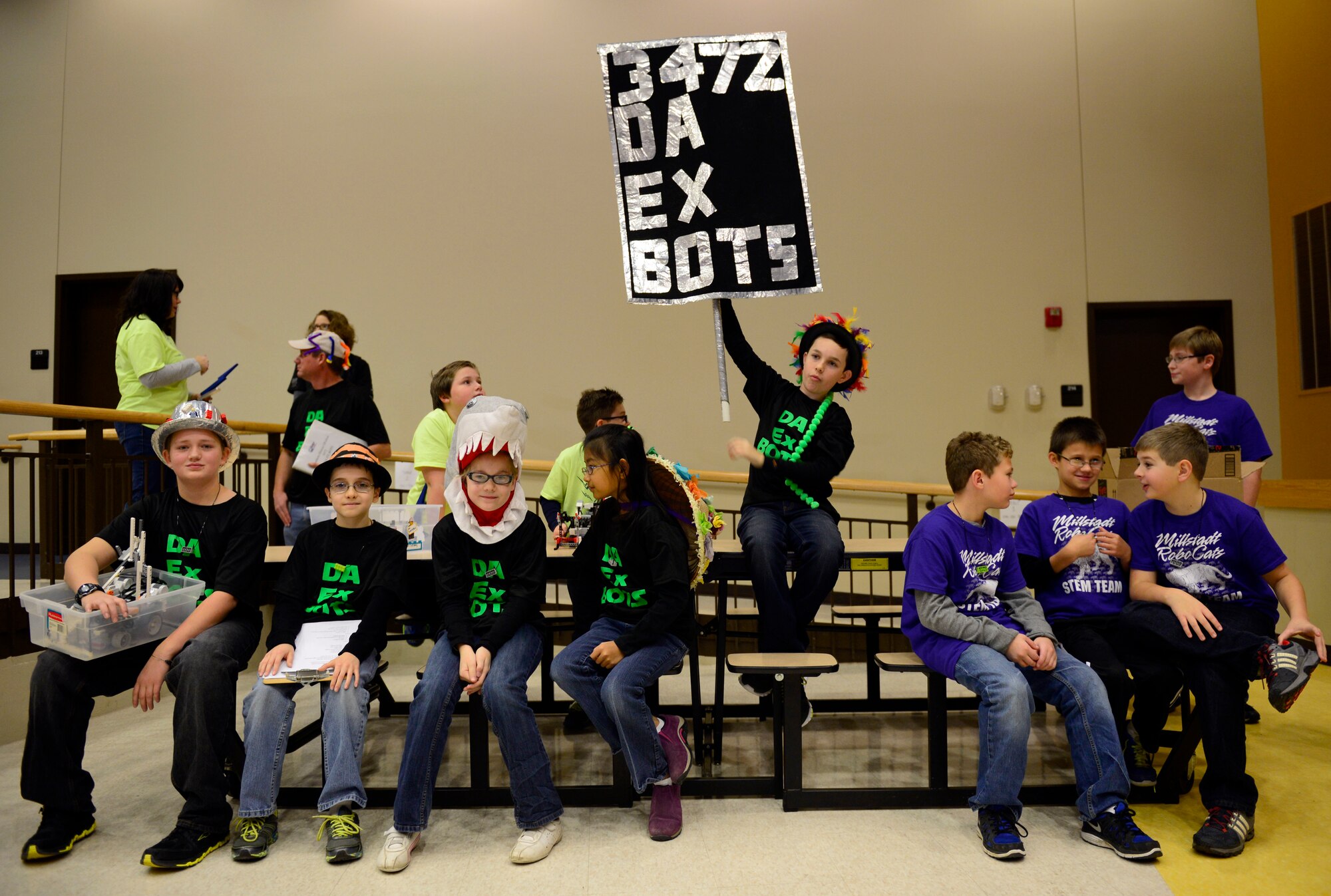 The team Da Ex Bots, cheer for their team prior to competing in the FIRST (For Inspiration and Recognition of Science and Technology) robotics tournament Nov. 22. Teams of Junior high school students build a robot that has to complete tasks to gain so many points. The top three teams with the most points advance to the regional competition. (U.S. Air Force photo/ Staff Sgt. Stephenie Wade)