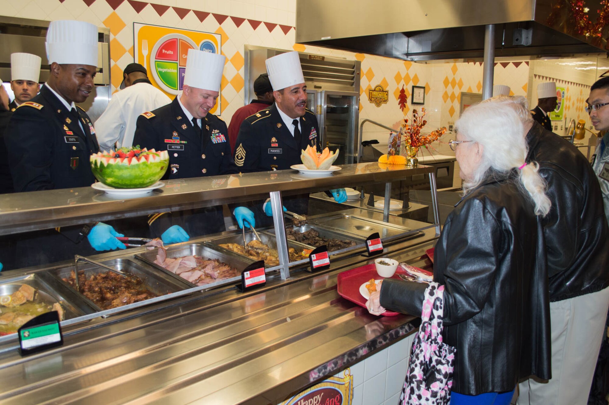 U.S. Army senior leaders from the 7th Transportation Brigade (Expeditionary) serve the Thanksgiving meal at the Resolute Dining Facility on Fort Eustis, Nov. 26, 2014. Civilian employees, Soldiers and their families were invited to partake in the feast..  (U.S. Army photo by Spc. Marian Alleva/Released)
