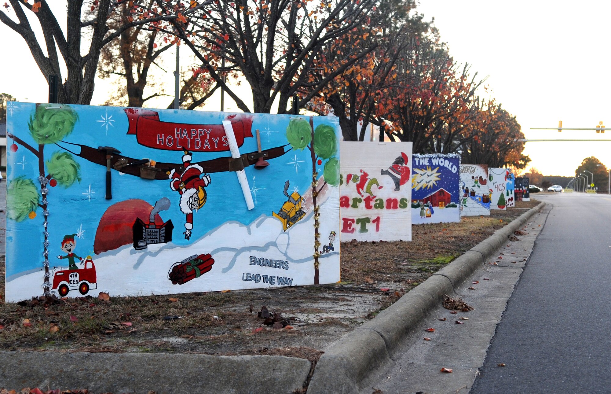 Holiday greetings from units across the base greet passersby at Seymour Johnson Air Force Base, North Carolina, Dec. 1, 2014. The posters and the base’s now lit tree are some of the ways Team Seymour has decorated the base for the holiday season. (U.S. Air Force photo/Senior Airman Ashley J. Thum)