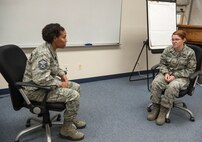 Master Sgt. Virmania Accoo, 51st Fighter Wing Equal Opportunity superintendent, and Senior Airman Vivienne Cassidy, 51st Logistics Readiness Squadron vehicle and equipment maintenance journeyman, as Sexual Assault Prevention and Response theater group members, act out a scene during a SAPR theater group meeting at Osan Air Base, Republic of Korea, Nov. 25, 2014. The group meets every week to practice and come up with new ideas for skits to present to each part of Osan’s population. (U.S. Air Force photo by Senior Airman Matthew Lancaster)