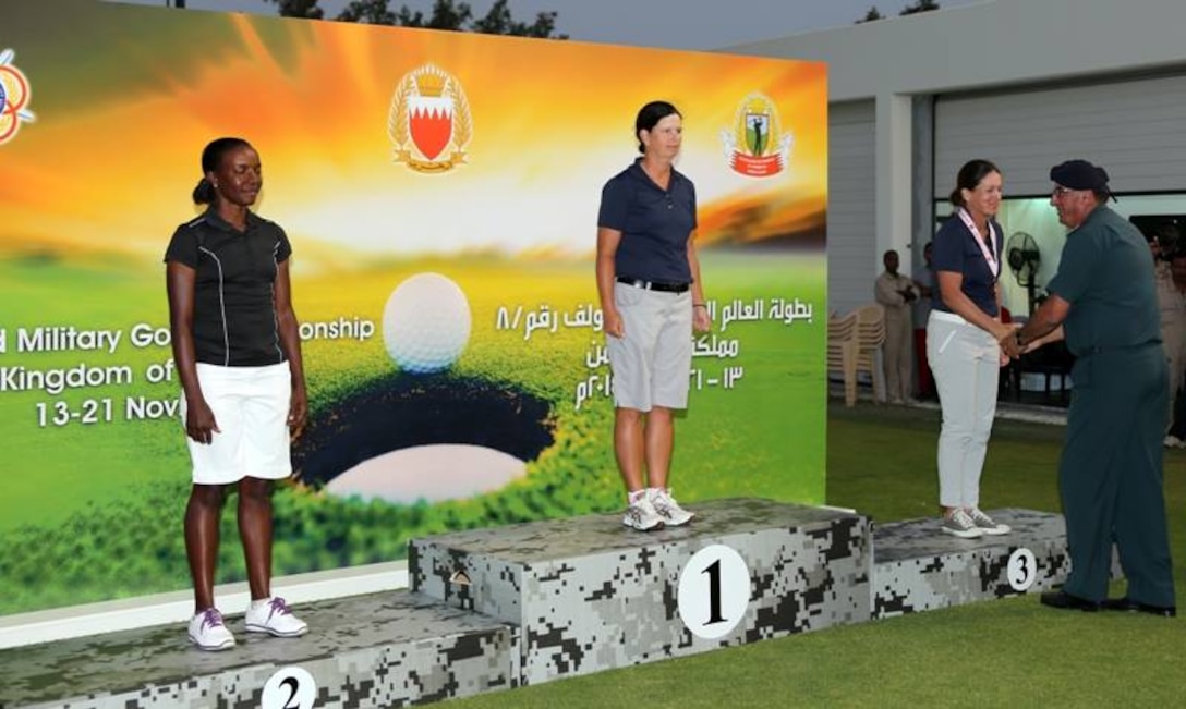 USAF Maj Linda Jeffery (center) and Navy LT Nicole Johnson (recieving her medal) win gold and bronze respectively.  The US Men and Women Armed Forces Golf teams won respective gold medals for the seventh time during the 8th CISM World Military Golf Championship held in Bahrain 13-21 November 2014.