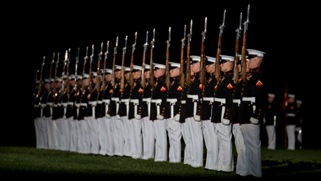 The Marine Corps Silent Drill Platoon performs during a Friday Evening Parade at Marine Barracks Washington, D.C., Aug. 22. (Official Marine Corps photo by Cpl. Larry Babilya/Released)