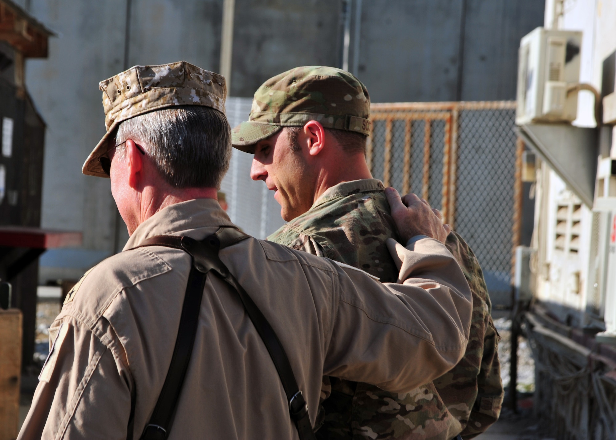 U.S. Air Force Gen. Hawk Carlisle, commander of Air Combat Command, meets with U.S. Air Force Capt. Michael Scott, 455th Air Expeditionary Wing Safety Office, during a visit Nov. 27, 2014 at Bagram Airfield, Afghanistan. Carlisle met with Airmen throughout the wing during his two-day visit. (U.S. Air Force photo by Staff Sgt. Whitney Amstutz/released)  