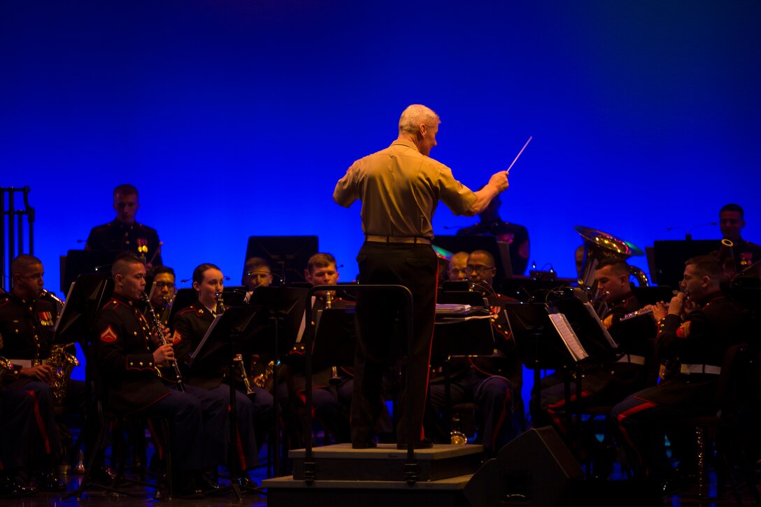 Lt. Gen. John A. Toolan, commander of U.S. Marine Corps Forces, Pacific, conducts the MARFORPAC band, during the 7th Annual Na Mele o na Keiki (Music for the Children) concert, Nov. 30 at the Hawai’i Theatre Center. The event accepted presents and money for “Toys for Tots”, every dollar and toy that was donated during the concert will go to the less fortunate keiki around the Hawaiian Islands.
