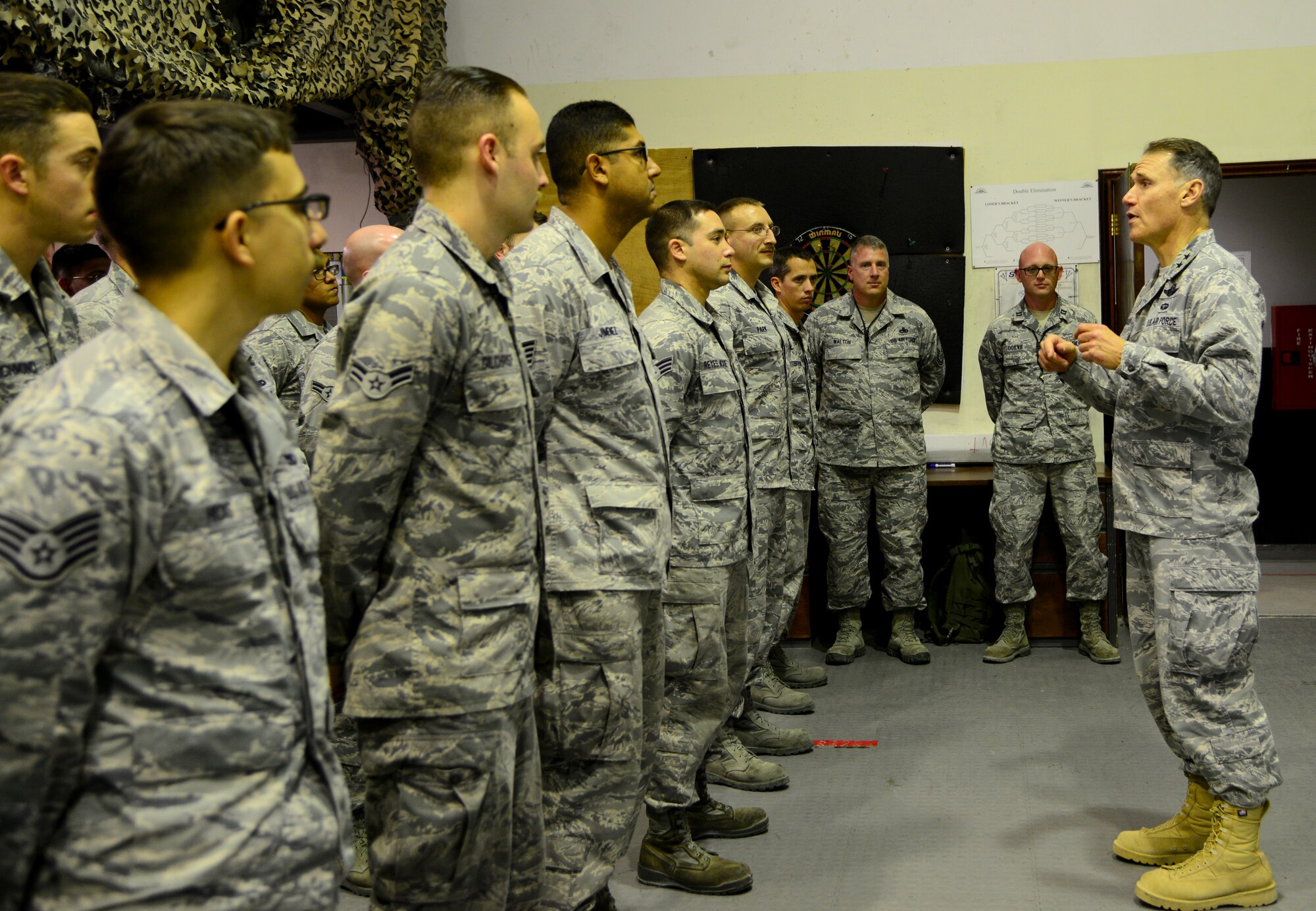 U.S. Air Force Chief of Safety Maj. Gen. Kurt Neubauer, right, speaks to Airmen from the 9th Expeditionary Aircraft Maintenance Unit during his visit, Dec. 2, 2014, to Al Udeid Air Base, Qatar. Neubauer recognized the 9th EAMU Airmen for their nomination for the Air Combat Command Aviation Maintenance Safety Award. This award recognizes an individual or team that significantly contributed to aviation maintenance safety, and  possesses a record of violation-free performance through the Quality Assurance and  Organizational Safety Office. (U.S. Air Force photo by Senior Airman Kia Atkins)