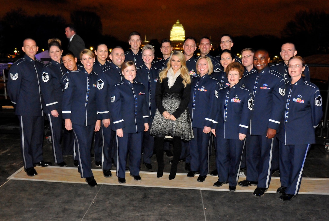 Members of the Singing Sergeants pose with Carrie Underwood backstage during "The Concert for Valor," which was held in Washington, D.C., on Nov. 11. (Photo by Eric Ritter/released)